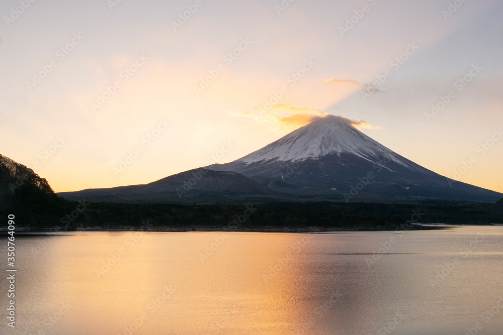 Sunrise is about to leave from the back of the Mount Fuji at Lake Motosu in Winter Japan