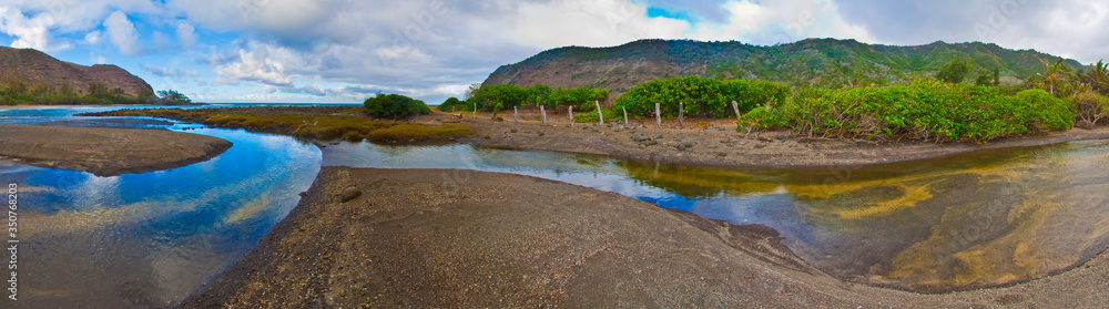 Halawa Stream Flowing Out of Halawa Valley and Onto Kawilli Beach, Halawa Beach Park, Molokai, Hawaii, USA Halawa Stream Flowing Out of Halawa Valley and Onto Kawilli Beach, Halawa Beach Park, Molokai, Hawaii, USA