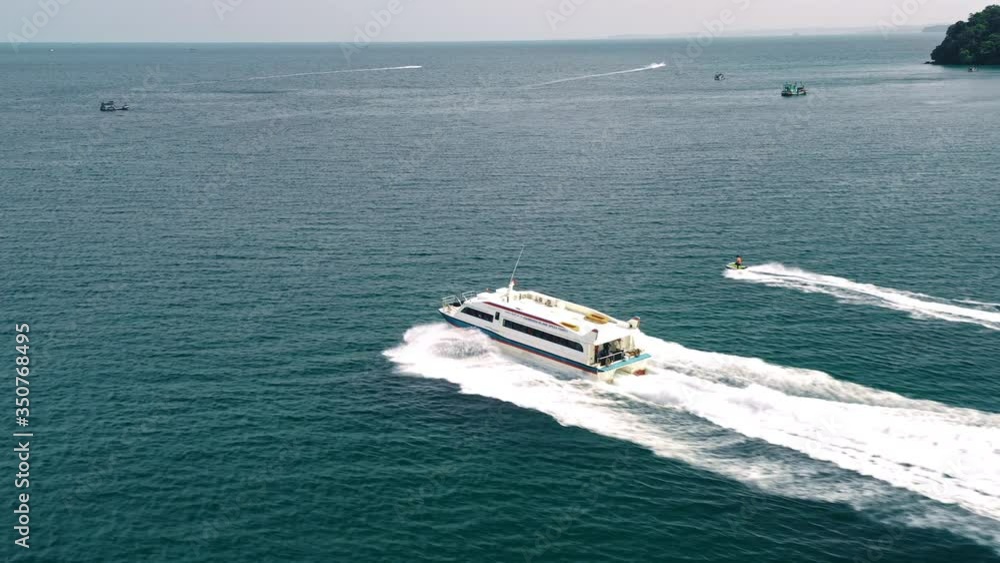 Tourist Speedboat And Jetski Travelling In Ocean, Aerial Tracking View. Tourist Speedboat And Jetski Travelling In Ocean, Aerial Tracking View.