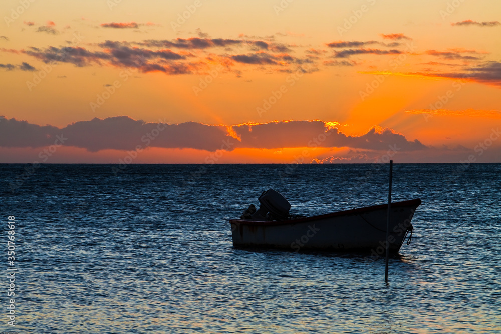 Silhouette of Small Fishing at Sunset, Kamalo Harbor, Molakai, Hawaii, USA