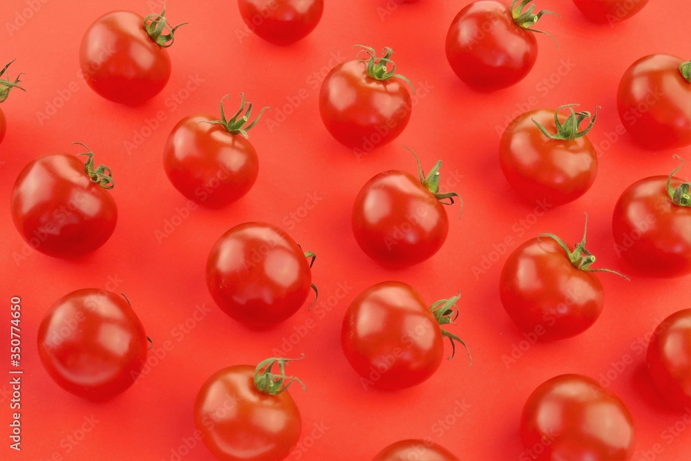 Tomato pattern. Tomato background. Red ripe tomatoes on a bright red background. Tomatoes season vegetables. Farm organic bio vegetables Tomato pattern. Tomato background. Red ripe tomatoes on a bright red background. Tomatoes season vegetables. Farm organic bio vegetables