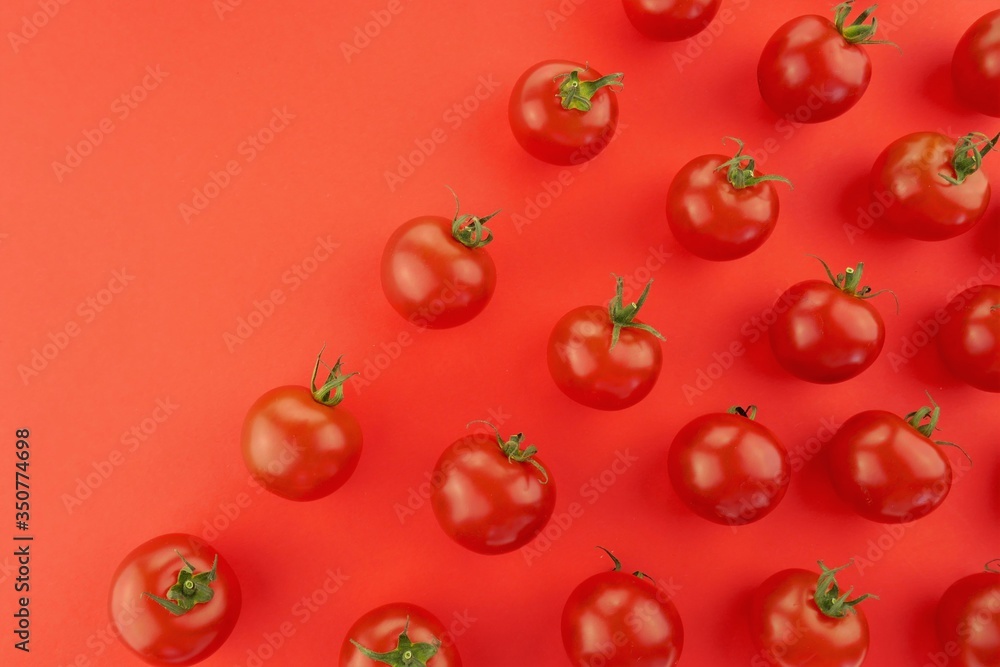 Tomato pattern. Tomato background. Red ripe tomatoes on a bright red background. Tomatoes season . Farm organic bio vegetables Tomato pattern. Tomato background. Red ripe tomatoes on a bright red background. Tomatoes season . Farm organic bio vegetables