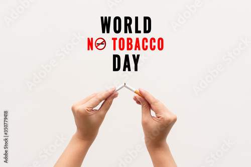 Quit smoking, no tobacco day, woman hands breaking the cigarette