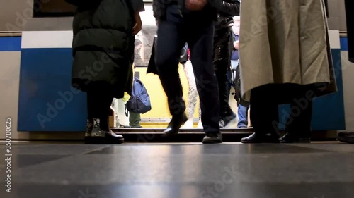 Low angle, from inside metro Moscow , the subway arrives and opens doors and Passengers go up and down from the metro