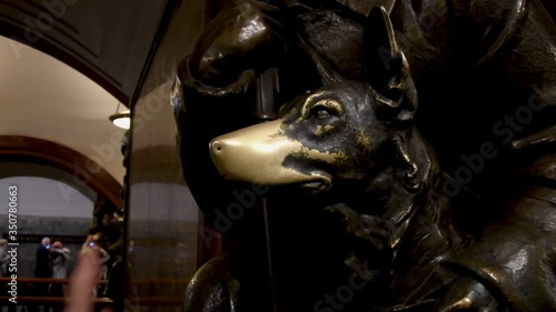 Rubbing the famous dog’s nose for good luck in metro Moscow