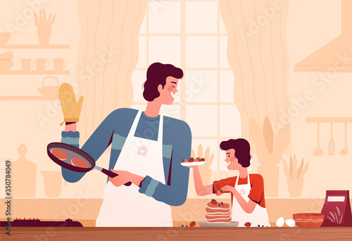 Cheerful dad and son cooking pancakes together at home in the kitchen. The concept of happy fatherhood and surprise for mom. Joint activity with a child