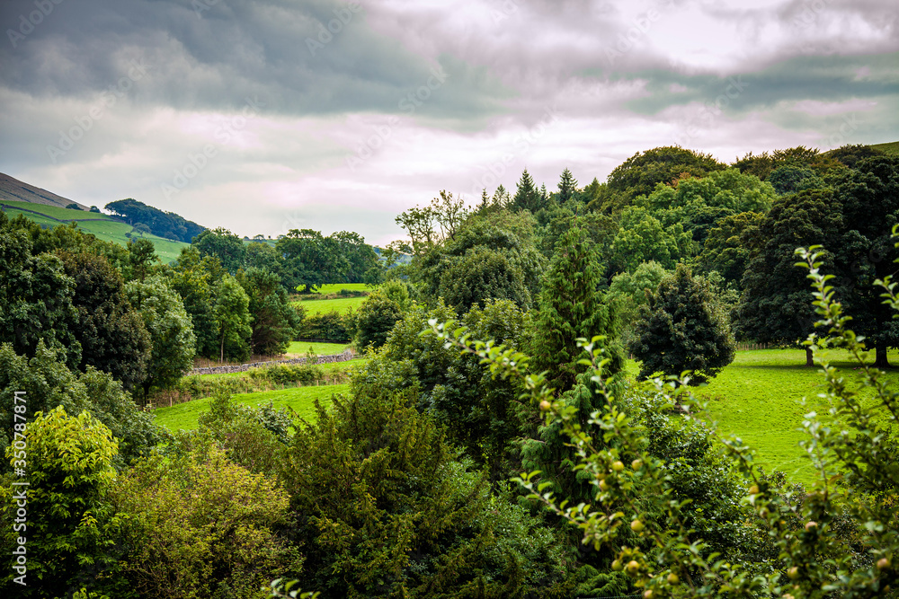 The English countryside of Downham Hill in Lancashire is a beautiful and romantic landscape. The English countryside of Downham Hill in Lancashire is a beautiful and romantic landscape.
