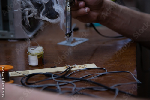 blowtorch, male hands, equipment repair at home