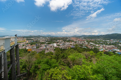 panoramic scene at Khao Rung Phuket viewpoint hilltop, home , building and green  tree. Sea and mountain long distance, beautiful cloudy blue sky background at day time, nature and travel concept.. © kae2nata