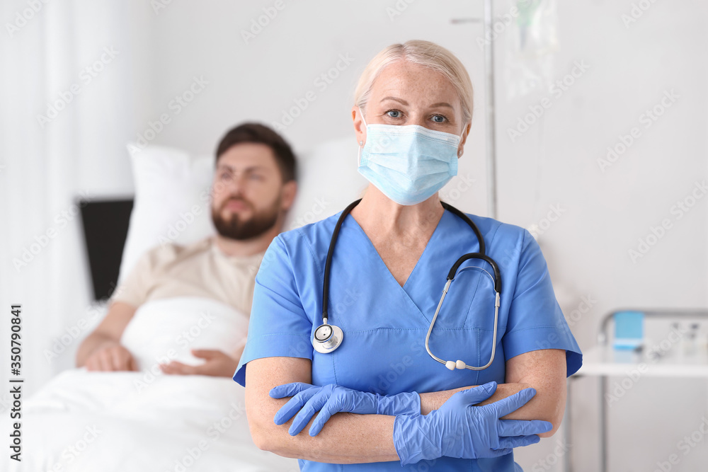 Mature female doctor in hospital room Mature female doctor in hospital room