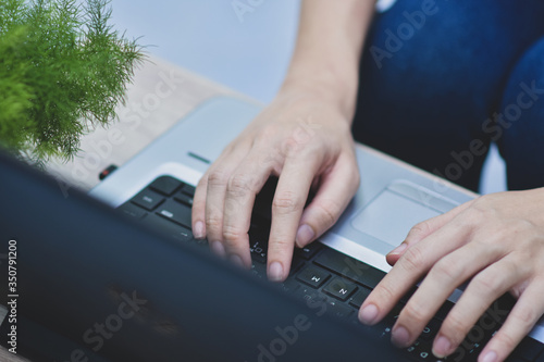 Wallpaper Mural Person using computer notebook working at home Torontodigital.ca