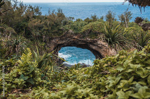 Natural rock arch in the sea on tropical island of Tonga