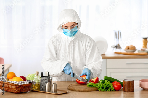 Woman in biohazard suit coo...