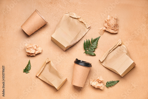 Paper bags with cups on col...