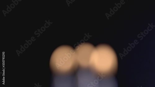 Beautiful Yellow Bokeh From Candle Lights On A Black Background. - close up shot photo