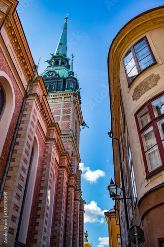 Steeple of the German Church Rises over the Beautiful Traditional Buildings in the Gamla Stan Neighborhood of Stockholm, Sweden