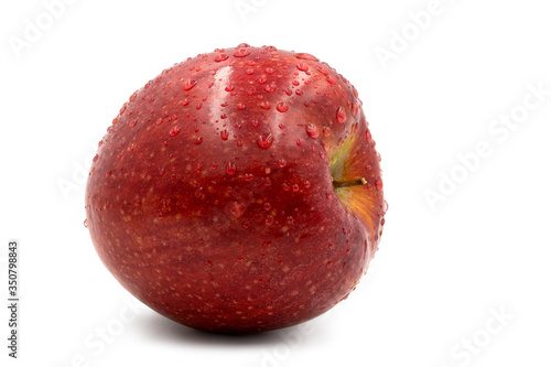 Fresh red apple with water drops isolated on white background.