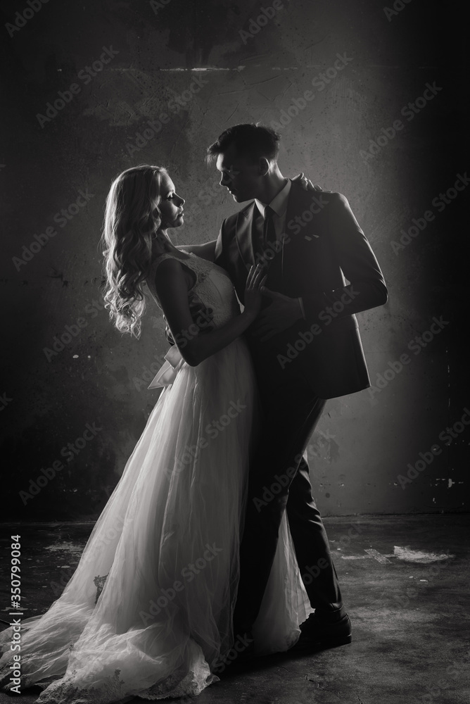 Art fashion studio photo of wedding couple silhouette groom and bride on colors background. Art Wedding style. Art fashion studio photo of wedding couple silhouette groom and bride on colors background. Art Wedding style.