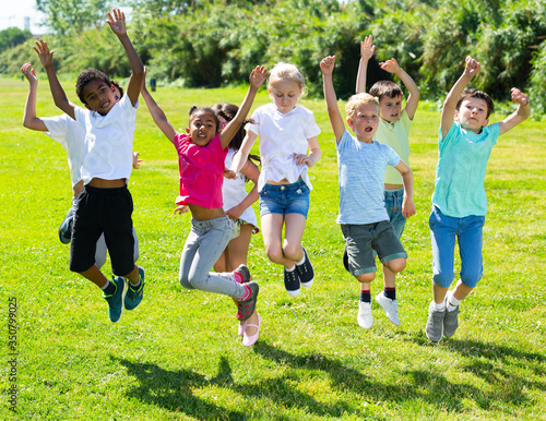 Εκτύπωση καμβά Group of happy children  jumping and smiling together