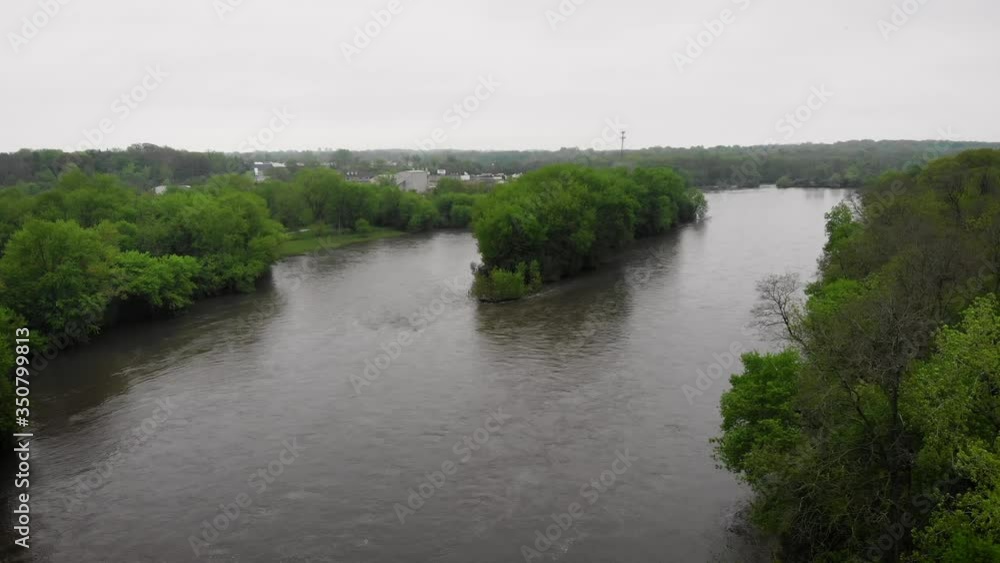 A drone shot of a midwest river on a gloomy day. A drone shot of a midwest river on a gloomy day.