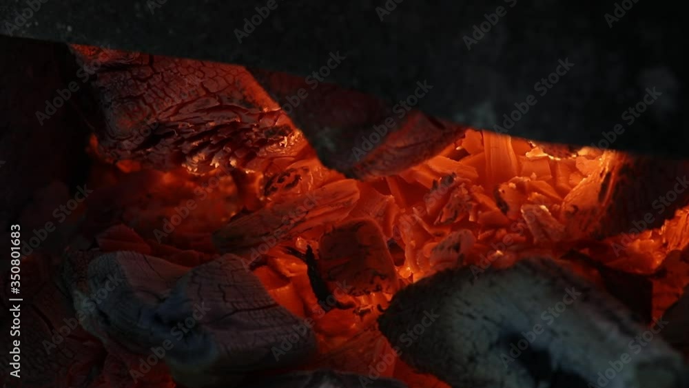 The fire is burning red-hot charcoal fire closeup video The fire is burning red-hot charcoal fire closeup video
