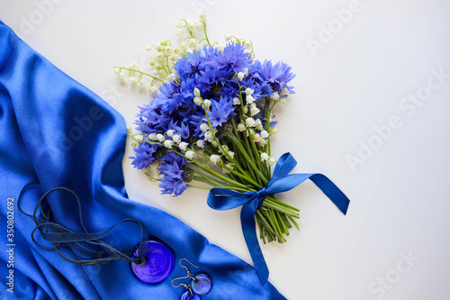 postcard mockup. a bouquet of blue cornflowers and space for text. invitation. congratulation