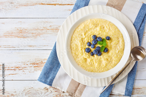 Εκτύπωση καμβά Creamy millet porridge in a white bowl