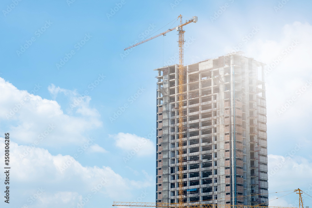 Crane and building construction and blue sky. Crane and building construction and blue sky.