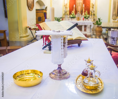 chalice for wine, blood of christ, and ciborium with host, body of christ, and ampoules with wine and water for consecration