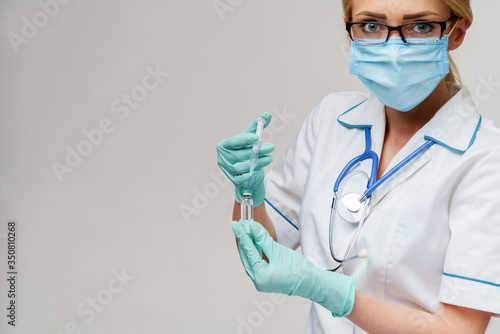 health medical worker woman holding vaccine and syringe