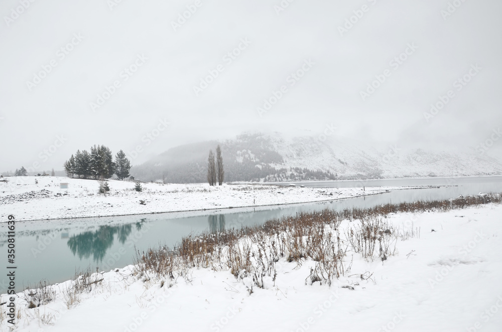 Beautiful snow scene of Lake tekapo, New Zealand. Picturesque by day and dazzling by night, Lake