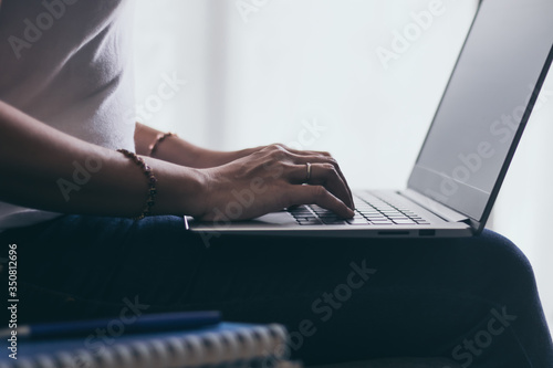 Businesswoman working or using laptop or computer for e-business at home. Student reading, learning & studying online webinar course or classroom via internet connection network. Education concept