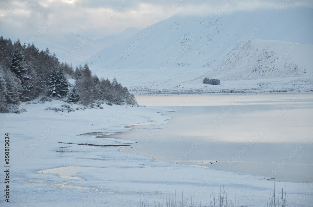 Beautiful snow scene of Lake tekapo, New Zealand. Picturesque by day and dazzling by night, Lake