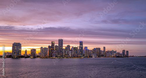 Miami city skyline panorama with urban skyscrapers over sea with reflection. Skyscrapers and harbor. © Volodymyr