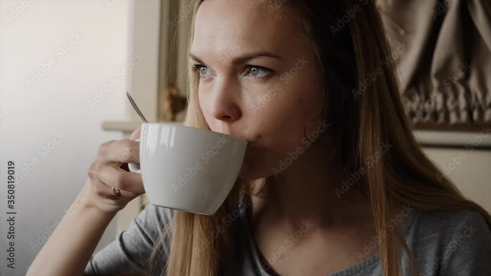 young woman with Cup of coffee in a cafe over lunch young woman with Cup of coffee in a cafe over lunch