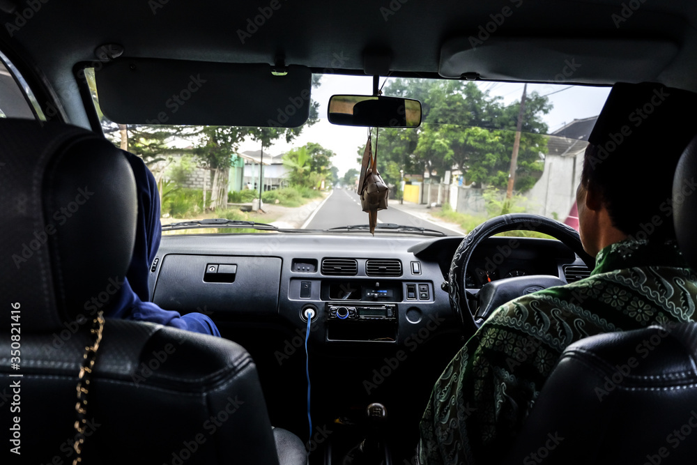 Fototapeta premium father was driving a car during Eid