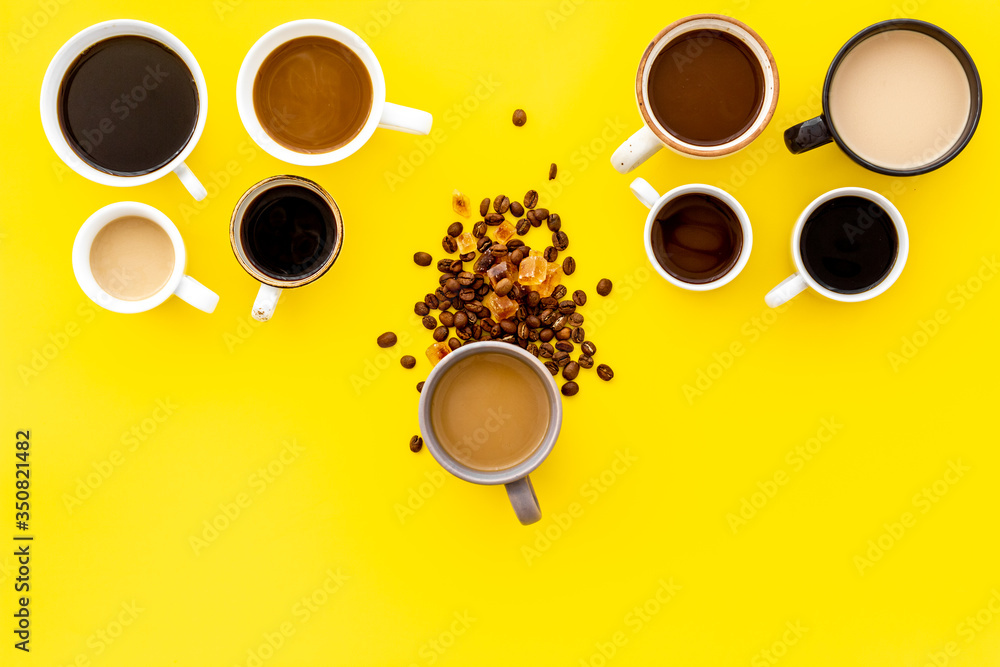 Lots of coffee on yellow background from above