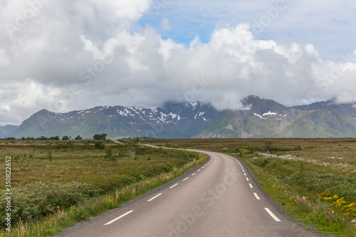 road passing in a valley between mountains in Norway, selective focus