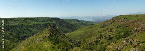 Israeli national park Gamla fortress at the Golan Heights with the Sea of Galilee in the distance