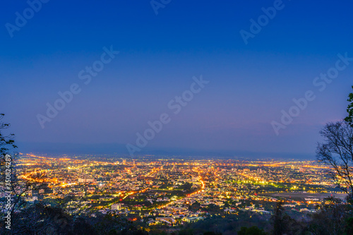 Beautiful of Landscape View cityscape over The color of the lights and city center of Chiang mai,Thailand at twilight night background. © Thinapob