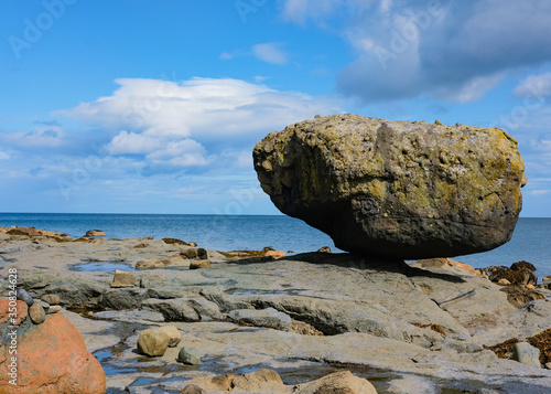 rock balancing next to the ocean