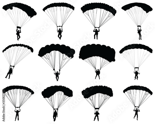 Black silhouettes of a paragliders on a white background