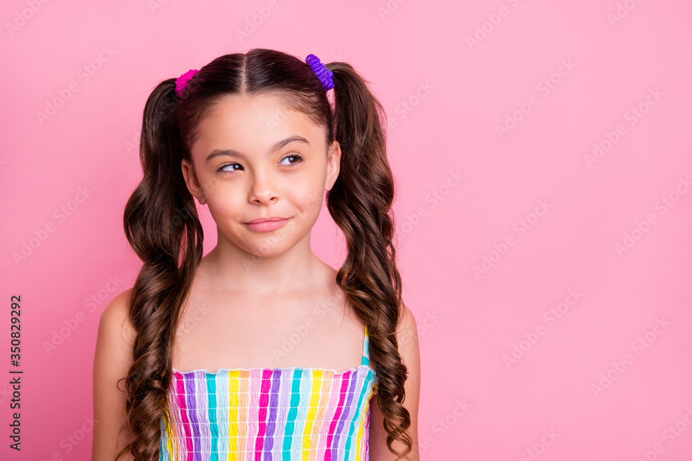 Photo of beautiful little lady model two lovely cute curly tails good mood look interested side empty space tricky wear colored dress summer singlet isolated pastel pink color background Photo of beautiful little lady model two lovely cute curly tails good mood look interested side empty space tricky wear colored dress summer singlet isolated pastel pink color background