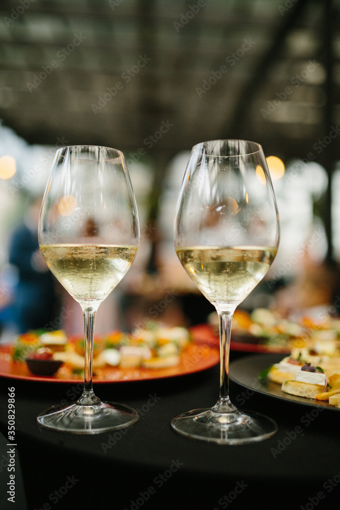 Wedding table with wine glasses and snacks. Wedding table with wine glasses and snacks.