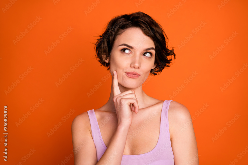 Portrait of interested girl touch chin finger look copyspace think thoughts weekend summer plans wear singlet isolated over bright color background Portrait of interested girl touch chin finger look copyspace think thoughts weekend summer plans wear singlet isolated over bright color background