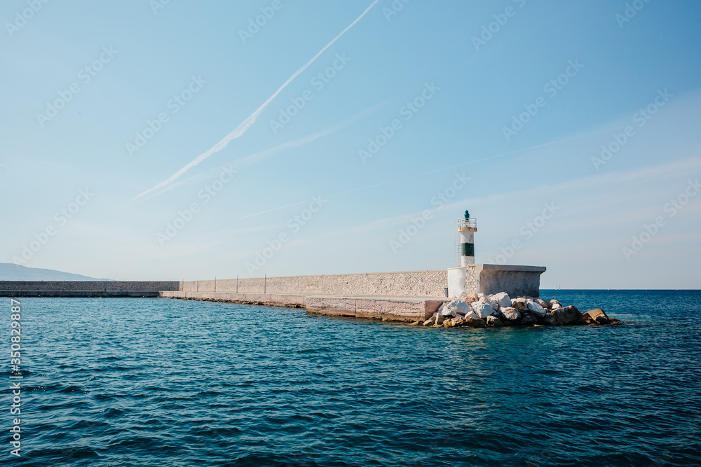 lighthouse on the island of crete greece, old lighthouse on the pier, ionian sea, greece