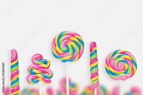 Set of colorful lollipops on white background.