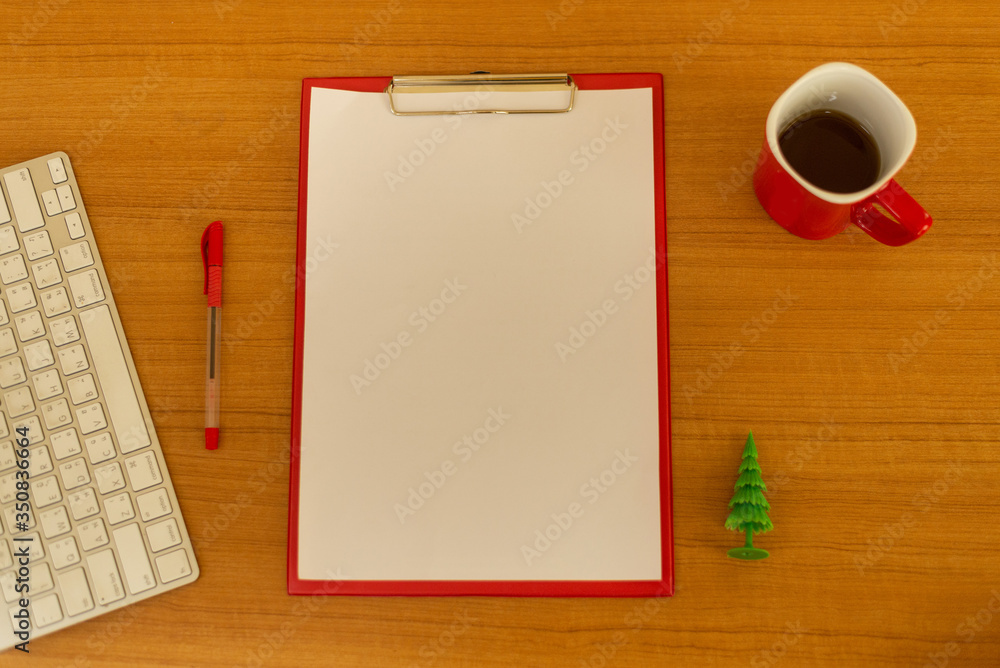 White paper and office equipment on a beautiful wooden floor View from the top corner White paper and office equipment on a beautiful wooden floor View from the top corner