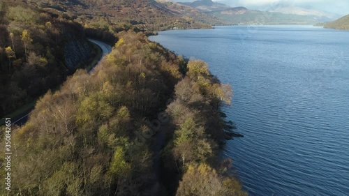 Main road running along side huge Loch Lomand Lake on sunny Scottish day photo