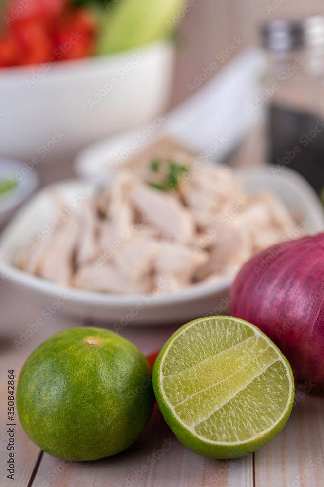 Half cut lemons and red onions placed on a wooden table. Half cut lemons and red onions placed on a wooden table.